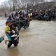 Hundreds of migrants march out of Greek camp, cross to Macedonia 