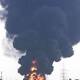 Tripoli fire rages as warplane crashes