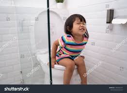 pooping little girl |2 years old girl reading on the potty Stock Photo - Alamy