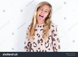 tongue girl|Portrait of a beautiful girl with her tongue out, isolated one white Stock  Photo - Alamy
