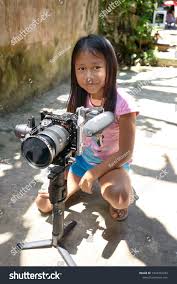 little indigenous girl|indigenous little girl from the Wayuri tribe, dressed in her traditional  clothing, gazes into the camera amidst the lush jungle of Puyo, Ecuador  Stock Photo - Alamy