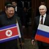 Kim Jong Un greets Vladimir Putin with late-night red carpet ...