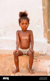 naked little girls |A small child with blond hair lies on the bed. Baby girl is ...