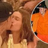 Hailey Bieber shares a steamy kiss with husband Justin Bieber as the married pair pack on the PDA during romantic ...
