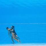 Photographer captures dramatic underwater rescue of unconscious swimmer Anita Alvarez
