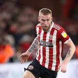 Oli McBurnie: Man arrested as part of a police probe into incident involving Sheffield United striker
