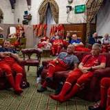 Photo shows Yeoman Warders taking a break from 20 minute shifts holding vigil in Westminster Hall