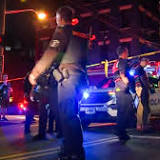 Shooting outside Cincinnati bar leaves nine people wounded as gunmen open fire after huge street fight