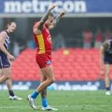 Suns shine in rain to down Dockers in AFL